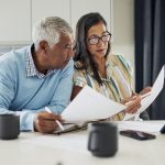 Older couple reviewing papers.