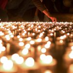 Lighting Memorial candles.